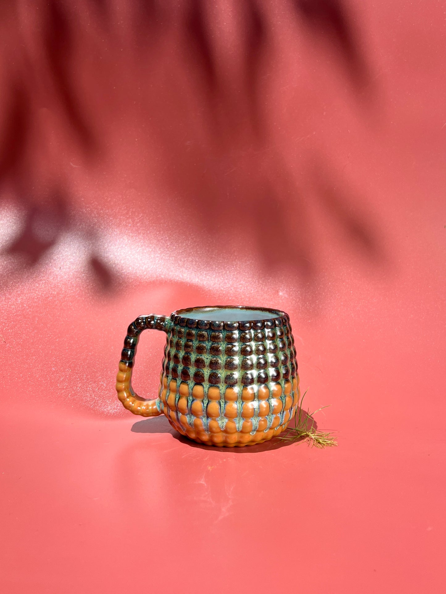 14oz Ludo Mug with All Over Big Dimple in Iron over Terracotta