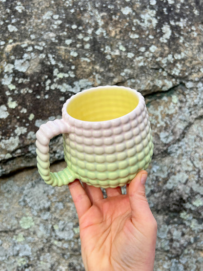 A DONATION Ludo Mug with All Over Big Dimple In Sherbert Fade