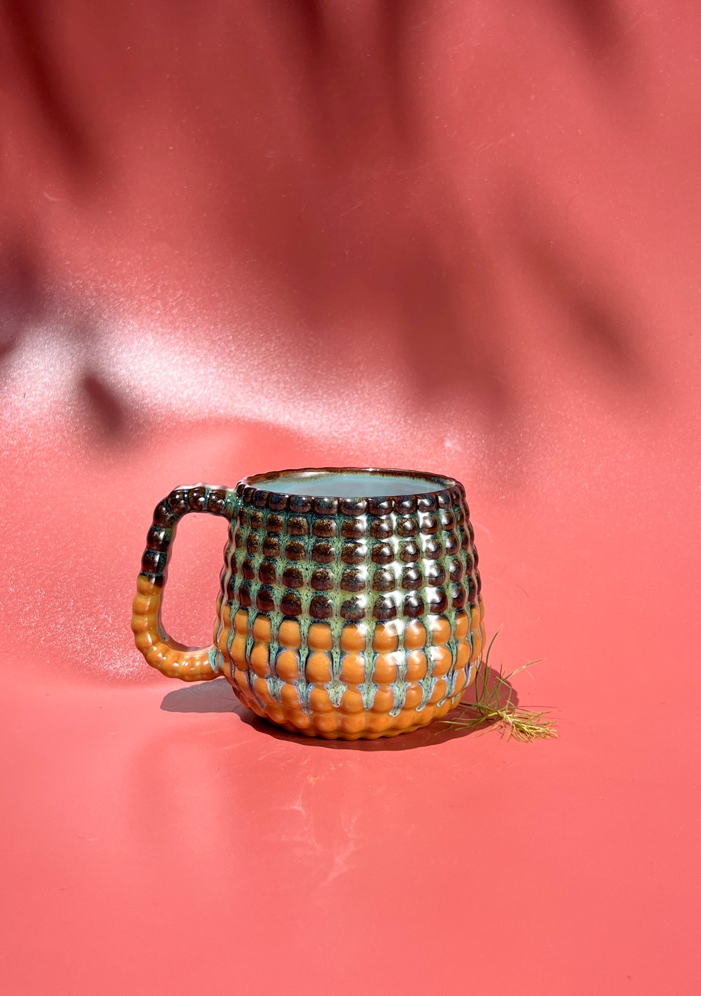 14oz Ludo Mug with All Over Big Dimple in Iron over Terracotta