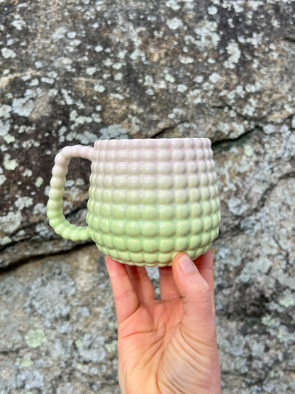 A DONATION Ludo Mug with All Over Big Dimple In Sherbert Fade