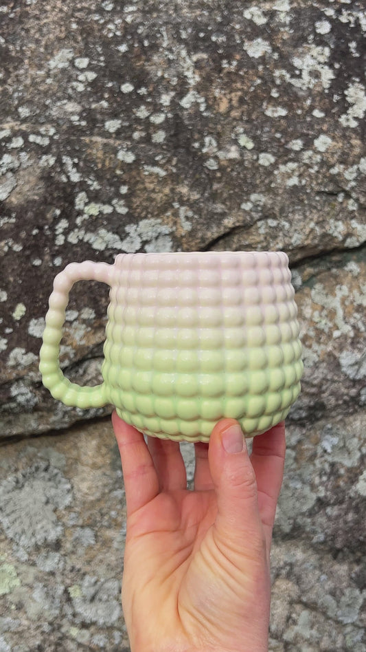 A DONATION Ludo Mug with All Over Big Dimple In Sherbert Fade